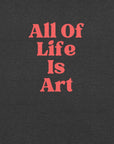 Close-up of dark grey heather Milk Sandwich T-shirt with bold red text that reads All Of Life Is Art, graphic slogan design in retro font.