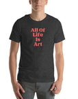 Man wearing dark grey heather Milk Sandwich T-shirt with bold red All Of Life Is Artslogan, minimalist graphic tee with retro typography on white background.