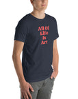 Angled view of man wearing heather navy Milk Sandwich T-shirt with bold red All Of Life Is Art text, modern unisex graphic tee with vintage font.