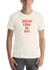 Man wearing vintage white Milk Sandwich T-shirt with bold red All Of Life Is Art slogan, minimalist graphic tee with retro typography on white background.