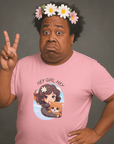 Man wearing a pink Milk Sandwich T-shirt with a cartoon girl and dog design and the phrase Hey Girl Hey, posing with peace sign and flower crown for playful retro-style fashion.