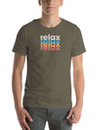 Man wearing a Milk Sandwich army t-shirt with a colorful stacked relax text design in white, blue, orange, and pink distressed print.