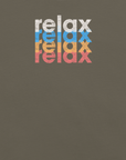 Close-up of a Milk Sandwich t-shirt featuring a stacked and mirrored relax text design in distressed white, blue, orange, and pink colors on army fabric.