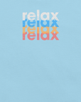 Close-up of a Milk Sandwich t-shirt featuring a stacked and mirrored relax text design in distressed white, blue, orange, and pink colors on ocean blue fabric.