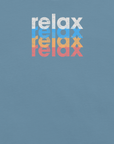Close-up of a Milk Sandwich t-shirt featuring a stacked and mirrored relax text design in distressed white, blue, orange, and pink colors on steel blue fabric.