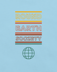 Close-up of a Milk Sandwich ocean blue t-shirt featuring a colorful retro-style graphic with the words ROUND EARTH SOCIETY in yellow, orange, and red stripes above a teal globe icon.