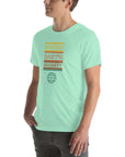 Angled side view of a person wearing a mint Milk Sandwich t-shirt with a colorful "Round Earth Society" graphic design.