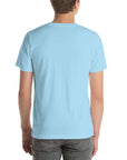 Back view of a person wearing a plain ocean blue Milk Sandwich t-shirt with no visible design.