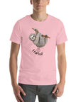 Man wearing a pink Milk Sandwich t-shirt with a smiling cartoon sloth hanging from a branch and the humorous phrase I farted below a small illustrated puff cloud.