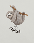 Close-up of a silver Milk Sandwich t-shirt with a cartoon sloth hanging from a branch and the humorous phrase I farted below a small illustrated puff cloud.