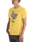 Yellow in a mint Milk Sandwich t-shirt with a humorous sloth illustration and the text I farted underneath, standing with one hand in his pocket.