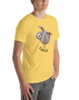 Side view of a man wearing a yellow Milk Sandwich t-shirt featuring a playful cartoon sloth hanging from a branch with the phrase I farted and a small puff cloud illustration underneath.