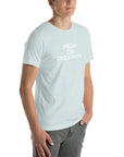 Young man wearing a ice blue t-shirt with white text ‘HIGH ON CREATIVITY’, standing angled to the side with hands in pockets.