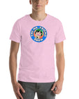 Man wearing a pink t-shirt featuring 'The Mr. Friend Show' logo with a colorful illustrated portrait and retro-style typography
