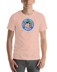 Man wearing a peachy t-shirt featuring 'The Mr. Friend Show' logo with a colorful illustrated portrait and retro-style typography