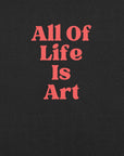 Close-up of  black heather Milk Sandwich T-shirt with bold red text that reads All Of Life Is Art, graphic slogan design in retro font.