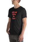Side view of man wearing  black heather Milk Sandwich T-shirt with red All Of Life Is Art text, casual graphic tee with vintage-style typography.