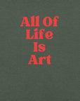 Close-up of heather forest Milk Sandwich T-shirt with bold red text that reads All Of Life Is Art, graphic slogan design in retro font.