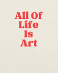 Close-up of vintage white Milk Sandwich T-shirt with bold red text that reads All Of Life Is Art, graphic slogan design in retro font.
