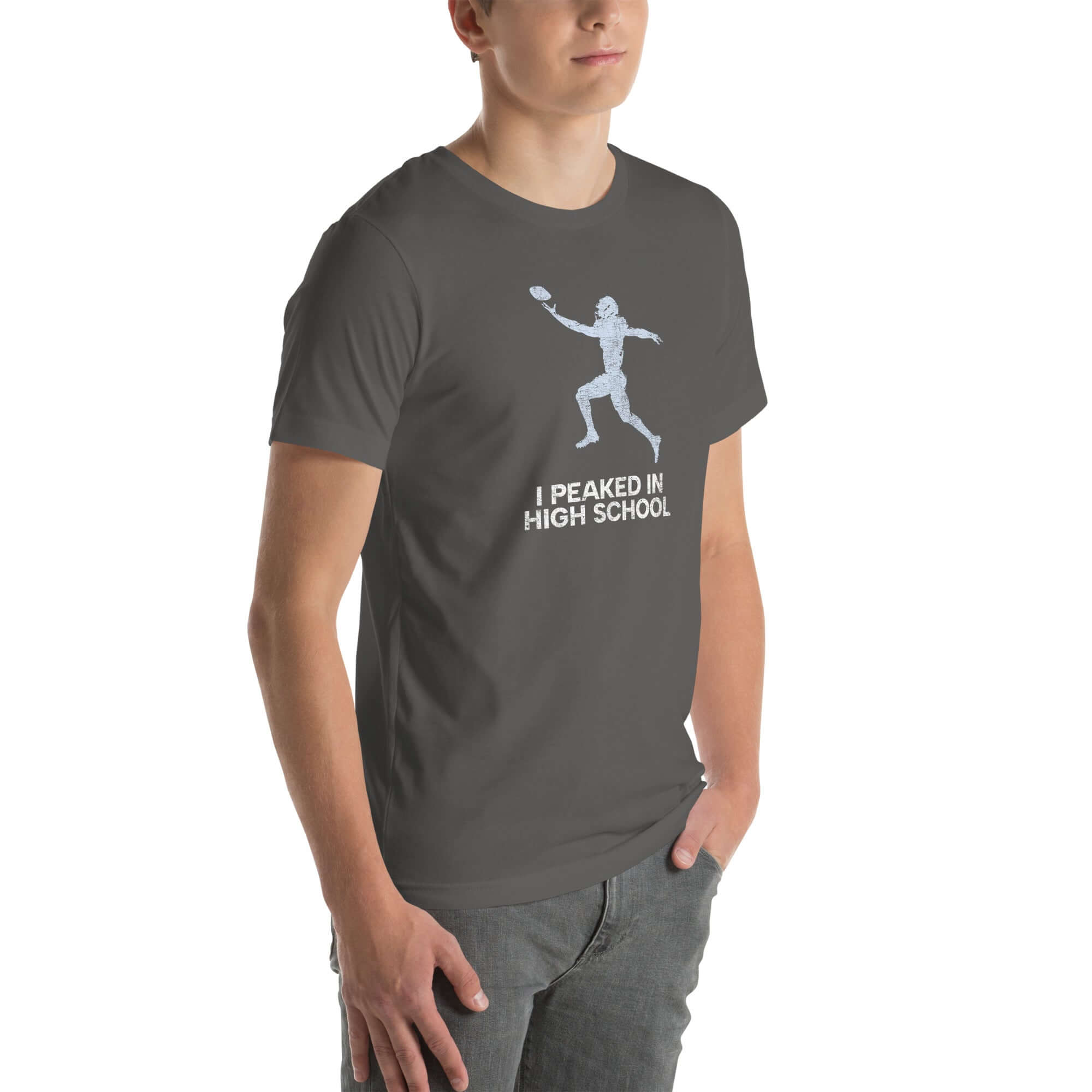 asphalt Milk Sandwich unisex t-shirt &#39;I Peaked in High School Football&#39; worn by a model, perfect for tailgates and sports nostalgia.