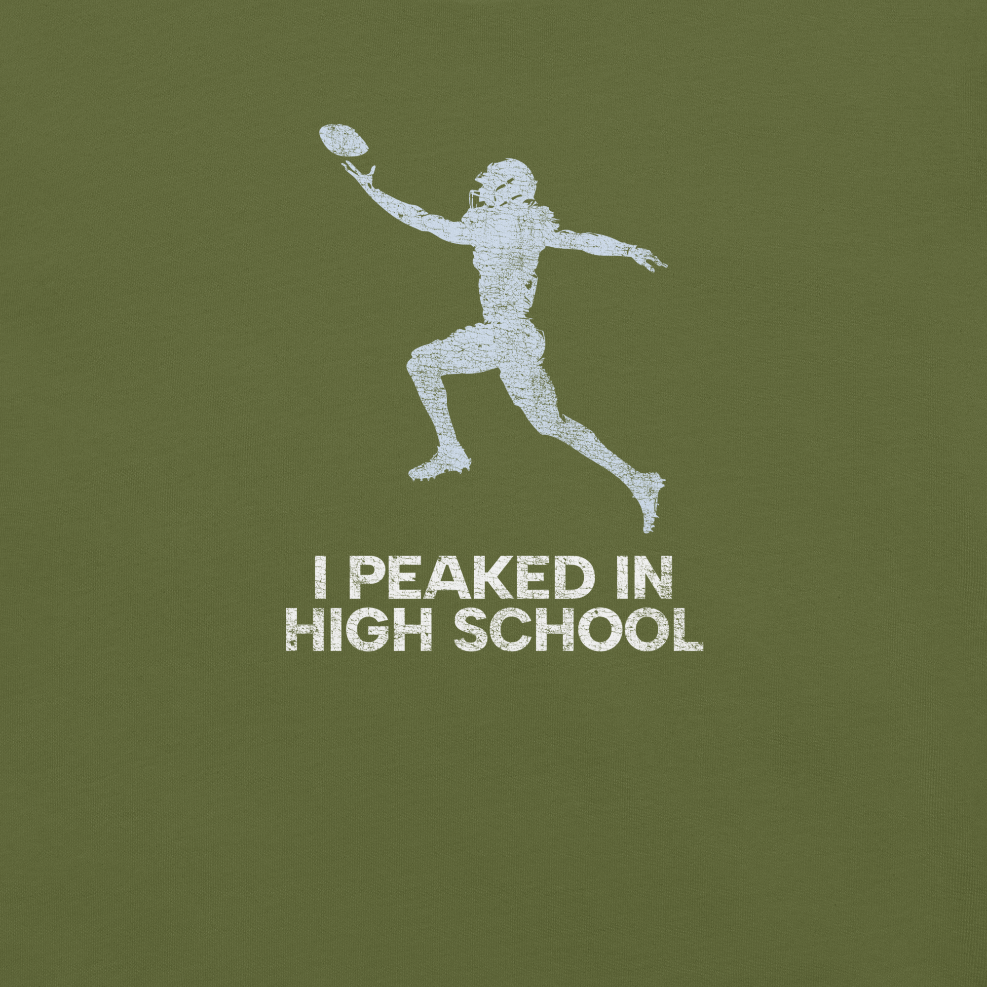 Close-up of olive Milk Sandwich T-shirt with distressed white football player graphic and text I Peaked in High School, ronic athletic nostalgia tee.