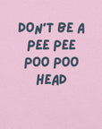Man wearing lilac “DON’T BE A PEE PEE POO POO HEAD” t-shirt, standing casually with hands by pockets.