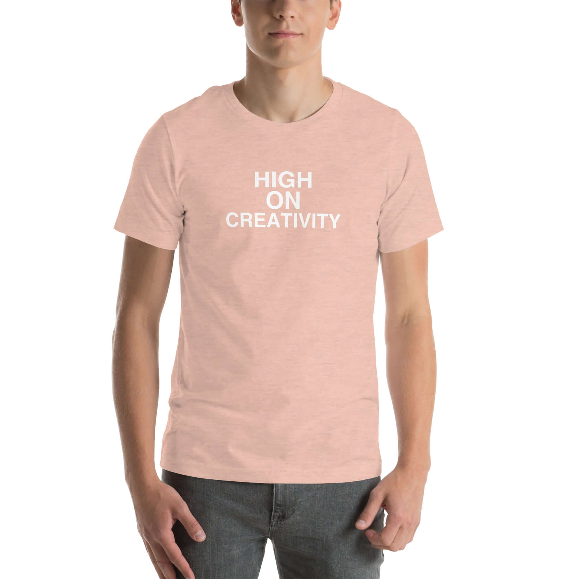 Man wearing a peach t-shirt with the text ‘HIGH ON CREATIVITY’ in bold white capital letters, centered on the chest