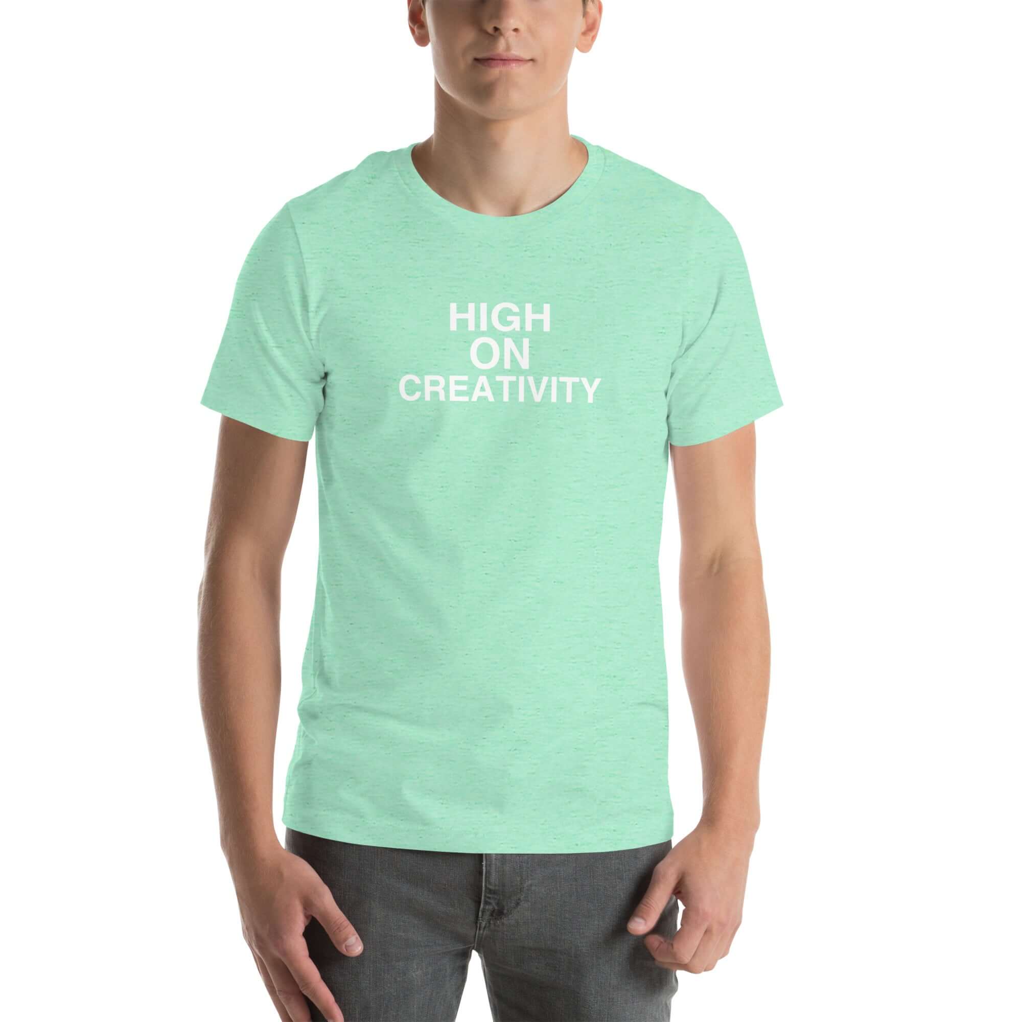 Man wearing a mint t-shirt with the text ‘HIGH ON CREATIVITY’ in bold white capital letters, centered on the chest
