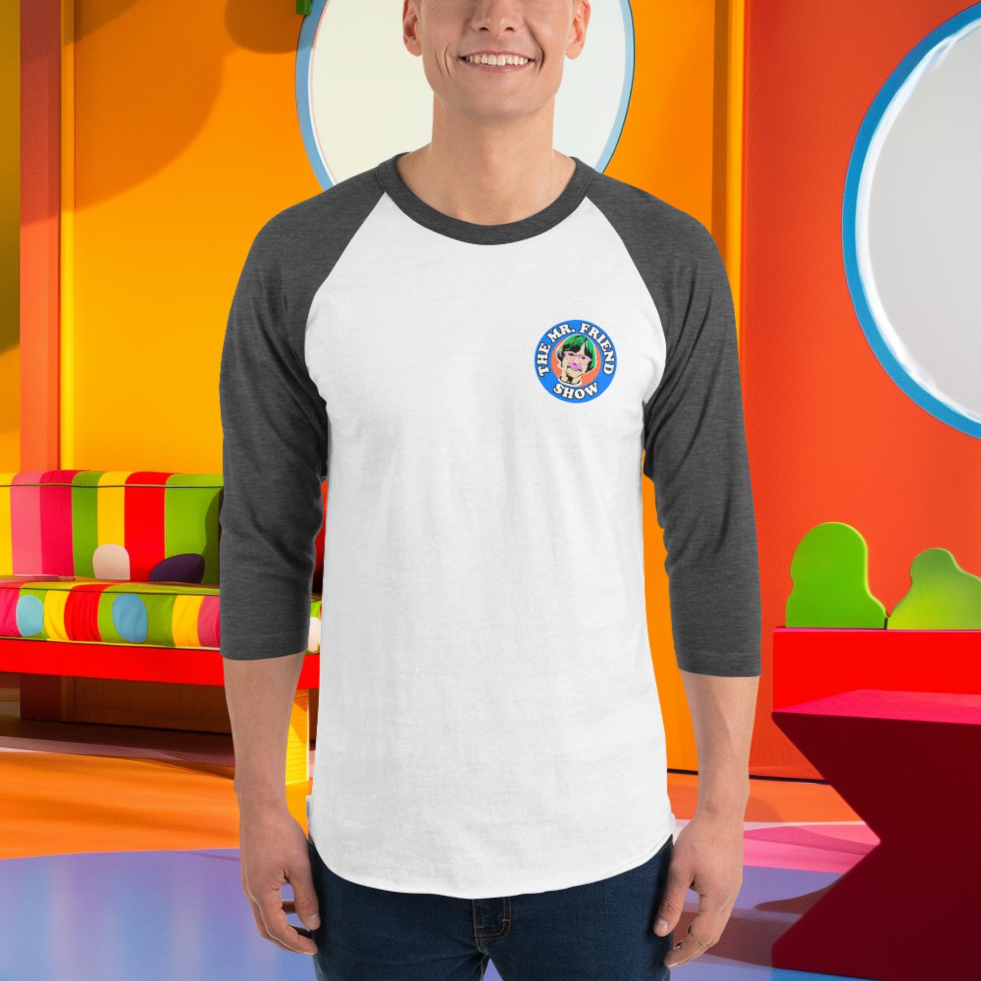 Man wearing The Mr. Friend Show 3/4 sleeve raglan shirt, featuring a playful design in a colorful background.