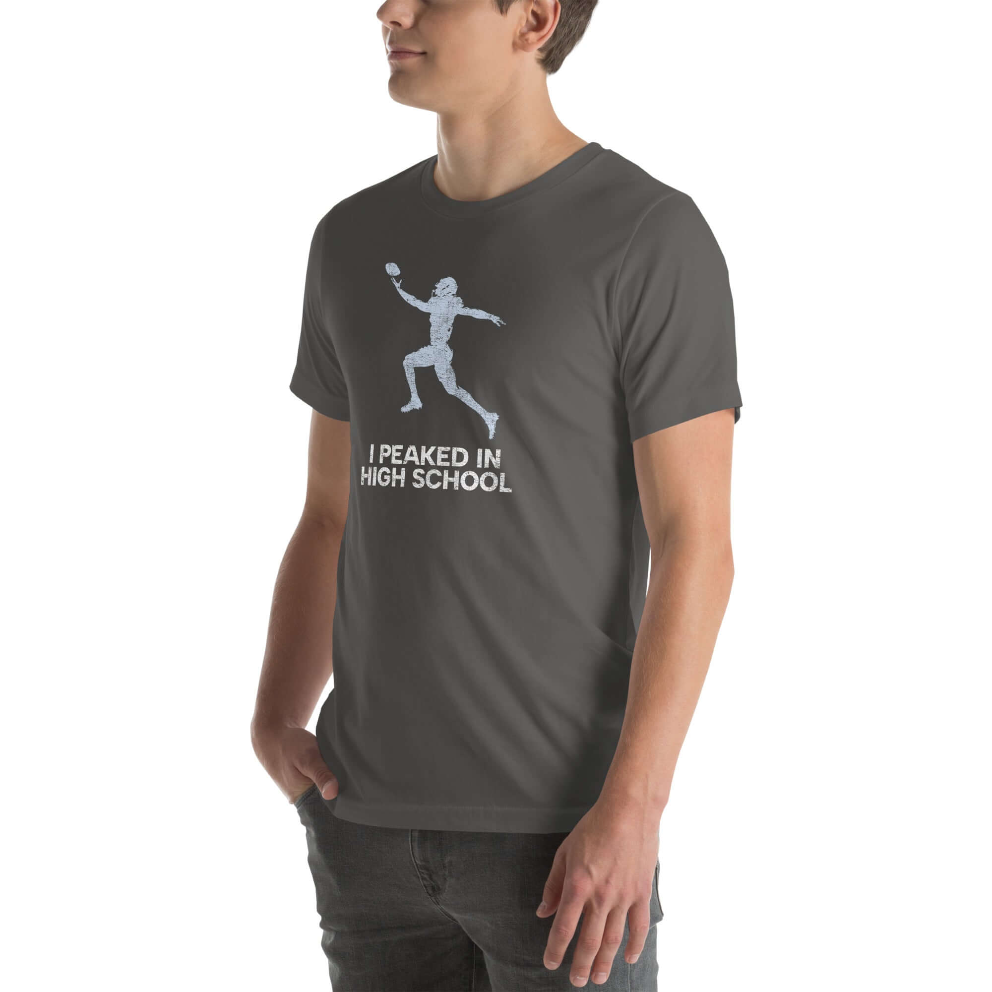 Unisex &quot;I Peaked in High School Football&quot; t-shirt in dark gray, perfect for sports fans and nostalgic moments.