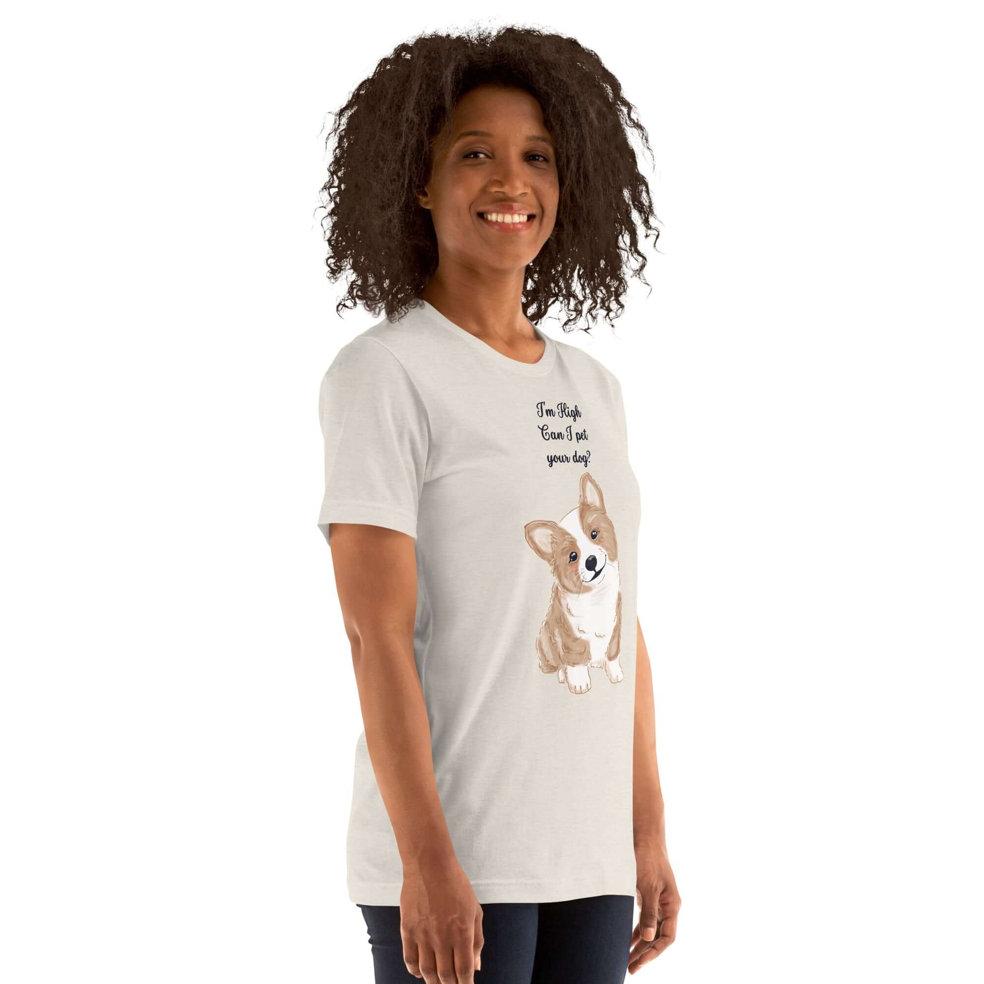 Woman wearing a soft unisex t-shirt with a cute corgi design and the phrase &quot;I&#39;m High, Can I Pet Your Dog.&quot;