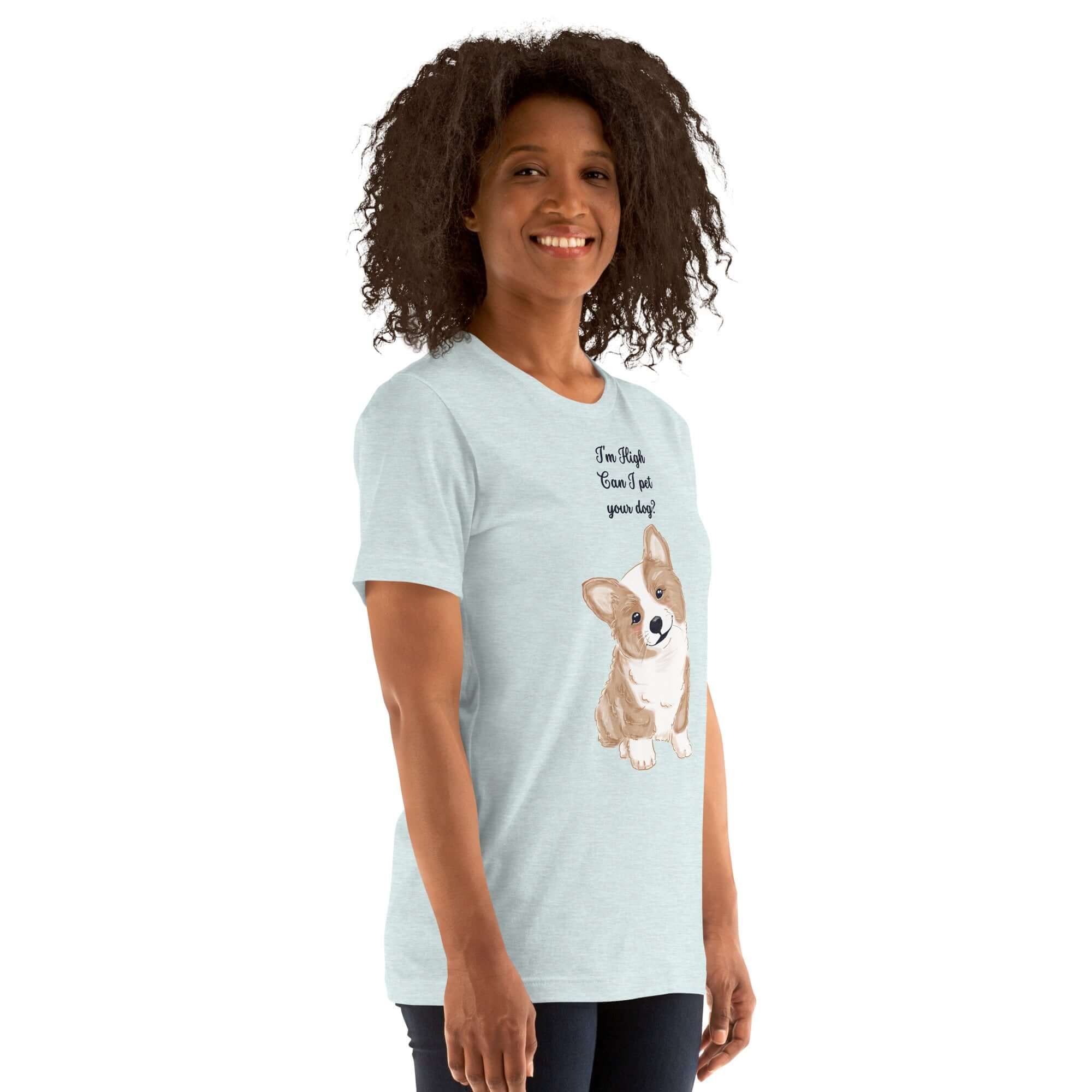 Unisex t-shirt with &quot;I&#39;m High, Can I Pet Your Dog&quot; text and a cute corgi design, worn by a smiling model.