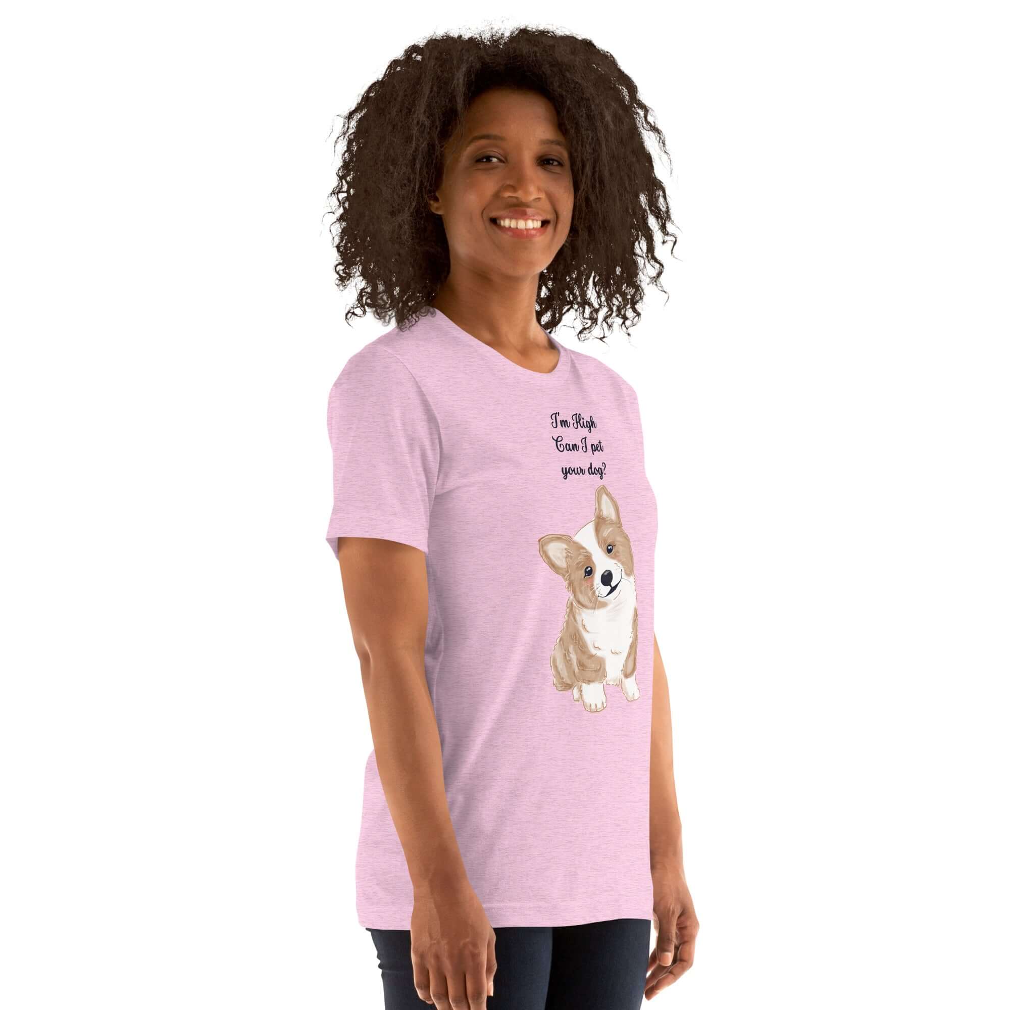 Woman wearing a soft pink t-shirt with a cute corgi graphic and the text, &quot;I&#39;m High, Can I Pet Your Dog.&quot;