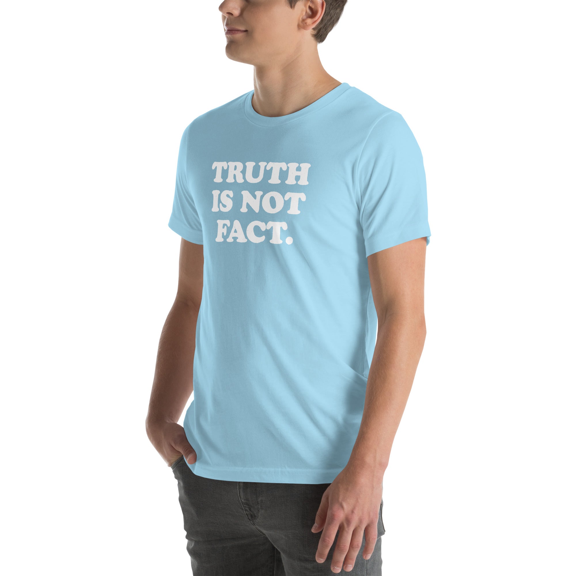 Unisex light blue t-shirt with the phrase &quot;Truth is Not Fact&quot; displayed prominently on the front.