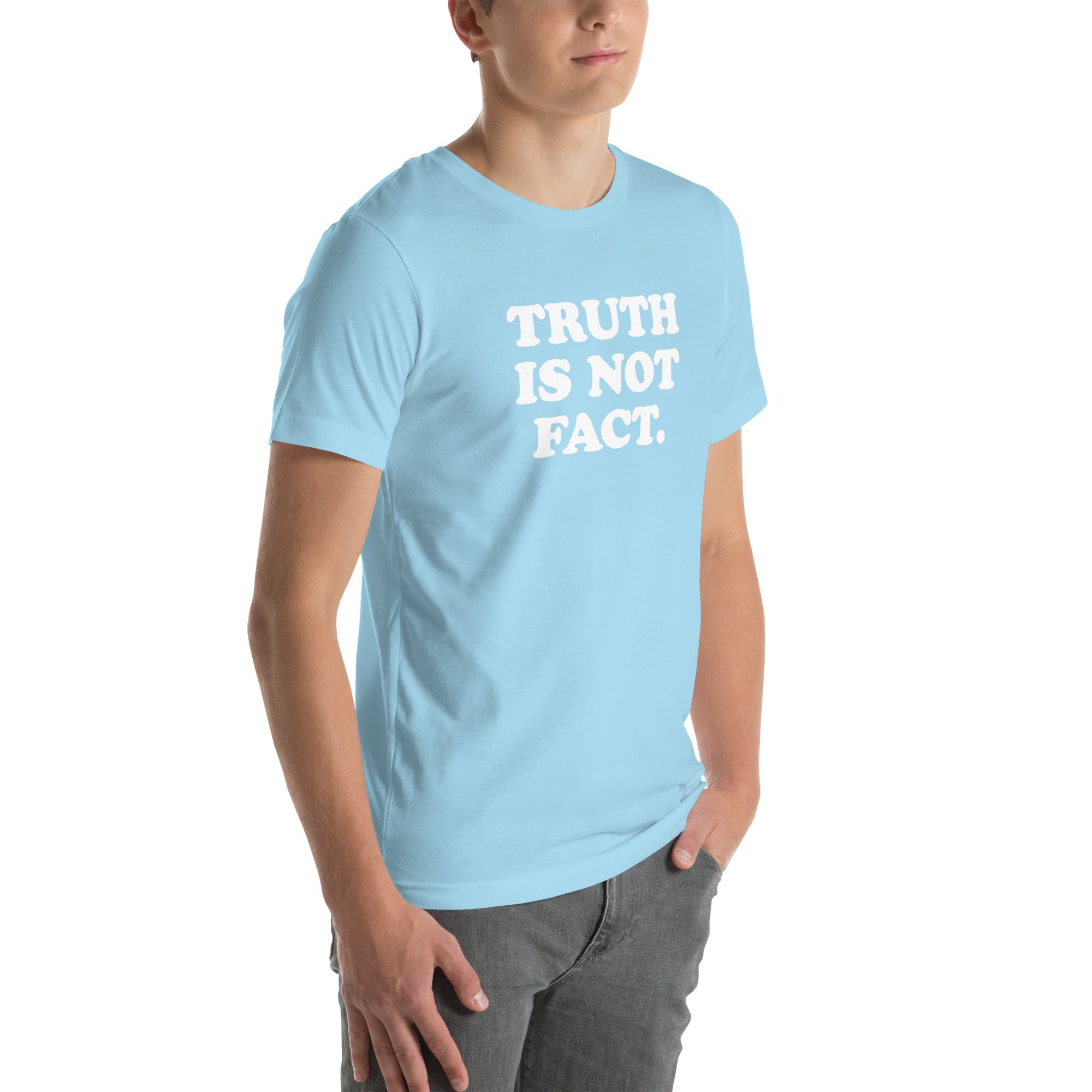 Unisex light blue t-shirt with the phrase &quot;Truth is Not Fact&quot; displayed prominently on the front. Perfect for comfortable wear.