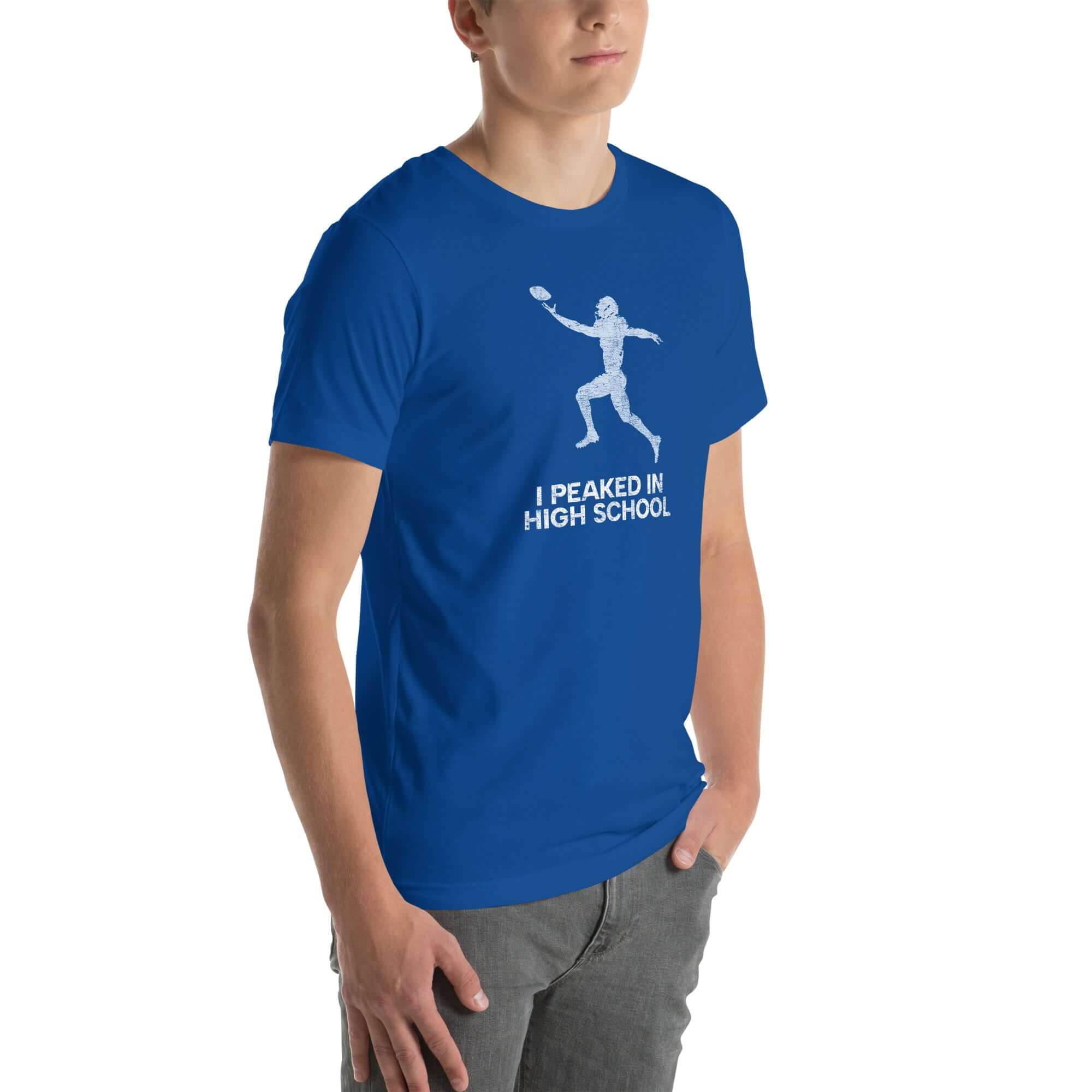 Blue unisex t-shirt featuring &quot;I Peaked in High School&quot; slogan, perfect for sports lovers and nostalgic moments.
